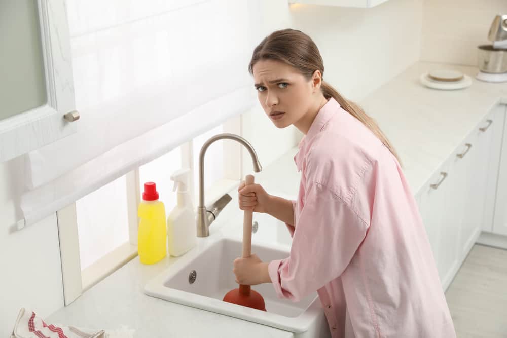 woman looking for residential plumbers in perth for clogged drains